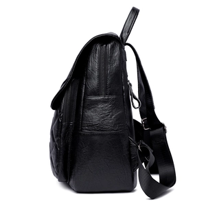 Vintage quilted leather backpack in black with adjustable straps and side pockets