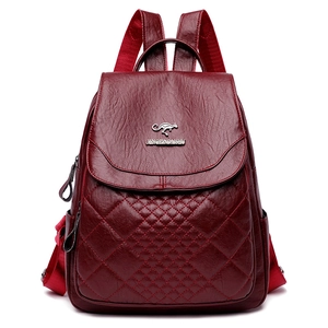 Deep red quilted faux leather backpack for women with metal kangaroo logo on front