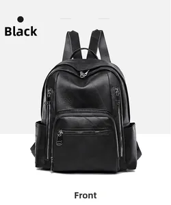 Detailed front view of black leather backpack with lychee texture and multi-zipper pockets