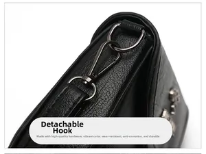 Detail of detachable gunmetal hook on black litchi texture leather crossbody bag
