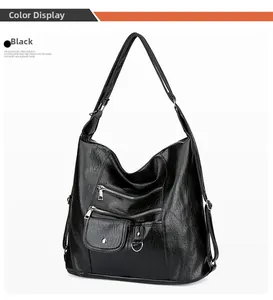 Détail du sac bandoulière en cuir souple noir avec plusieurs poches et compartiments zippés