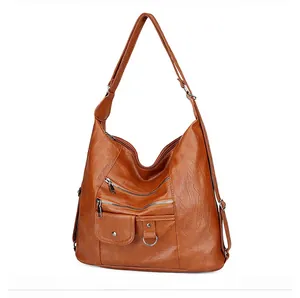 Vue latérale du sac bandoulière marron rétro avec design multi-poches et cuir souple