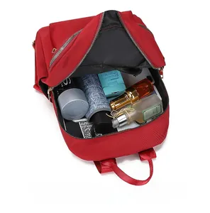 Vue de dessus du sac à dos en tissu Oxford montrant le rangement iPad et essentiels