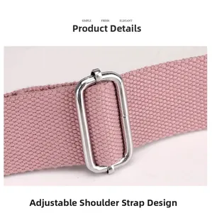 Detail of pink nylon shoulder strap with adjustable silver metal buckle on crossbody bag