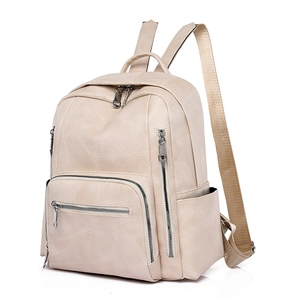 Zaino da donna minimalista color crema in pelle con cuciture a spirale e tasca
