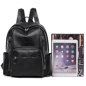 Minimalist black quilted leather backpack with large capacity for travel and school use