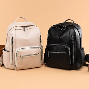 Zaino chic in pelle PU beige e nero con trama a venature e tasche con cerniera laterali
