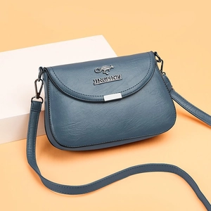 Navy blue faux leather crossbody bag for women with flap closure and metal kangaroo logo
