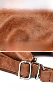 Detail of brown litchi pattern leather texture and silver metal side buckle adjustment