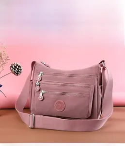 Detail of high-density waterproof nylon crossbody bag with multiple zipper pockets