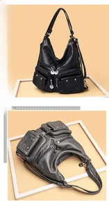 Detailed view of multi-pocket soft PU leather handbags with metallic zippers and studs