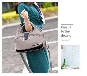 Detail view of water-resistant oxford nylon bag with adjustable canvas shoulder strap