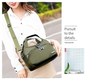 Olive green water-resistant oxford shoulder bag styled with casual outfit on street