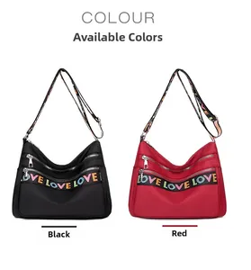 Detail showing red and black nylon crossbody bags with multi-zipper and LOVE strap