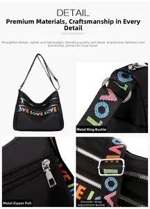 Detailed view of oxford crossbody bag featuring sturdy silver metal zippers and LOVE straps