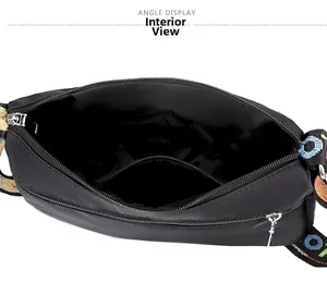 Top view of spacious interior storage and black lining of the Oxford crossbody bag