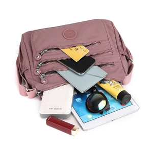 Waterproof nylon crossbody bag in lotus pink with multi-pockets for large storage capacity