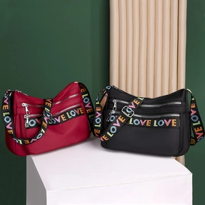 Waterproof nylon crossbody bags in black and red with colorful LOVE letter straps
