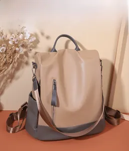 Detail of soft PU leather backpack showing high texture, side pockets and metal zipper