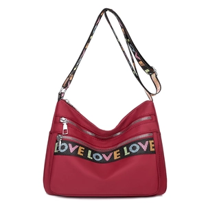 Burgundy nylon crossbody bag with multi-pockets and rainbow LOVE embroidered straps