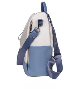 Detail of color-blocked PU leather backpack with side anti-theft zipper and woven straps