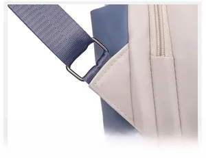 Detail of durable metal D-ring and reinforced stitching on high-quality PU leather backpack