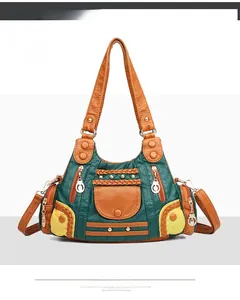 Front view of multi-pocket retro color-block handbag with woven trim and gold rivets