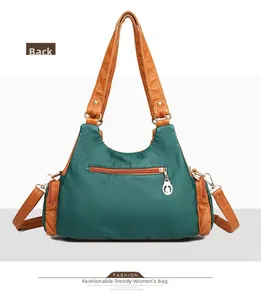 Detailed back view of vintage green washed leather tote with contrast brown straps