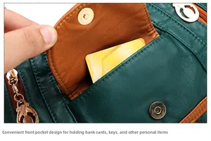 Detail of dark green leather tote with magnetic front pocket for card storage