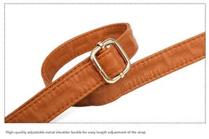 Macro shot of adjustable brown PU leather strap with golden square buckle hardware detail