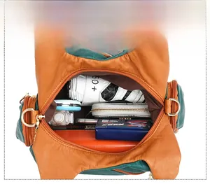 Interior view of large capacity vintage soft leather tote bag with various daily essentials