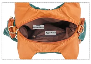 Interior view of large capacity crossbody bag showing main pocket and zipper pocket