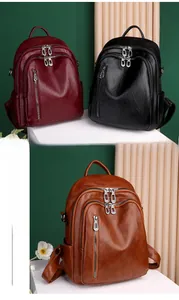Detail view of large capacity vintage PU leather backpacks in black, red and caramel brown