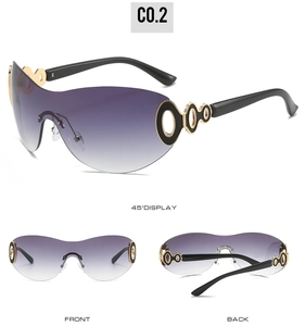 Detail view of Y2K shield sunglasses with gradient purple lenses and gold metal accents