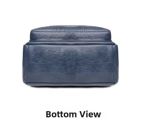 Detail view of the deep blue textured leather backpack base with precise stitching