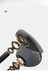 Detail of Y2K shield sunglasses showing golden hollow ring temple and gradient lenses