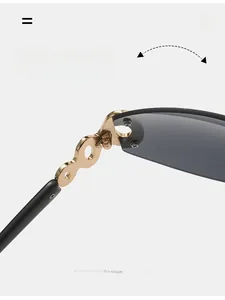Close-up of durable golden metal hinge on Y2K oversized shield sunglasses with grey lenses