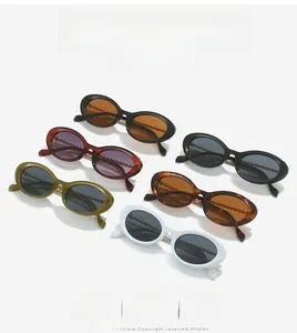 Detail of six retro oval sunglasses in various colors with elegant gold chain link lenses