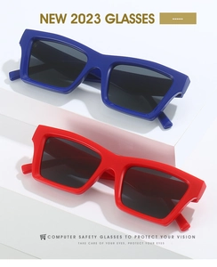 Blue and red rectangular sunglasses with thick frames and protective lenses in detail
