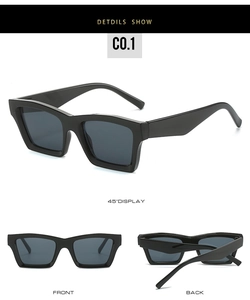 Detail view of bold square black sunglasses with thick temples and high-quality dark lenses