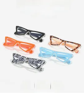 Five pairs of trendy cat-eye glasses in various patterns like leopard and zebra print