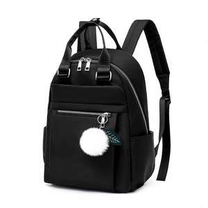 Sac à dos minimaliste en tissu Oxford noir avec pompon en peluche et charme de feuille
