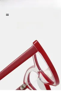 Detailed macro view of red cat-eye glasses frame featuring durable metal hinge connection