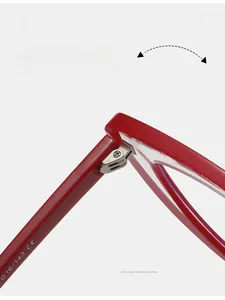 Detail of durable metal hinges on red cat-eye TR glasses frame with CE certification