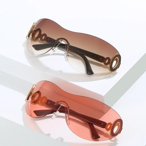 Modern Y2K oversized shield sunglasses with gradient lenses and gold circular hardware