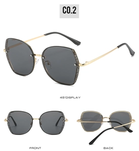 Detailed views of oversized geometric sunglasses with slim gold metal temples and dark grey lenses