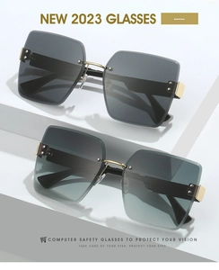 Detail of rimless square sunglasses with grey gradient lenses and gold rivets