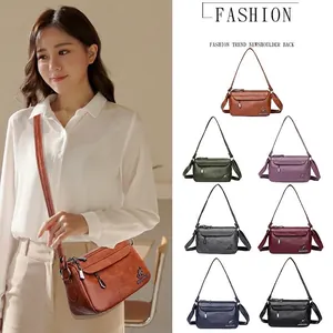 Minimalist soft PU leather crossbody bag with lychee texture and multiple zip compartments