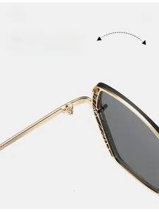 Detail of durable gold metal hinge on black frames for stylish sunglasses