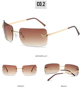 Three angles of rimless butterfly sunglasses with brown gradient lenses and crystals